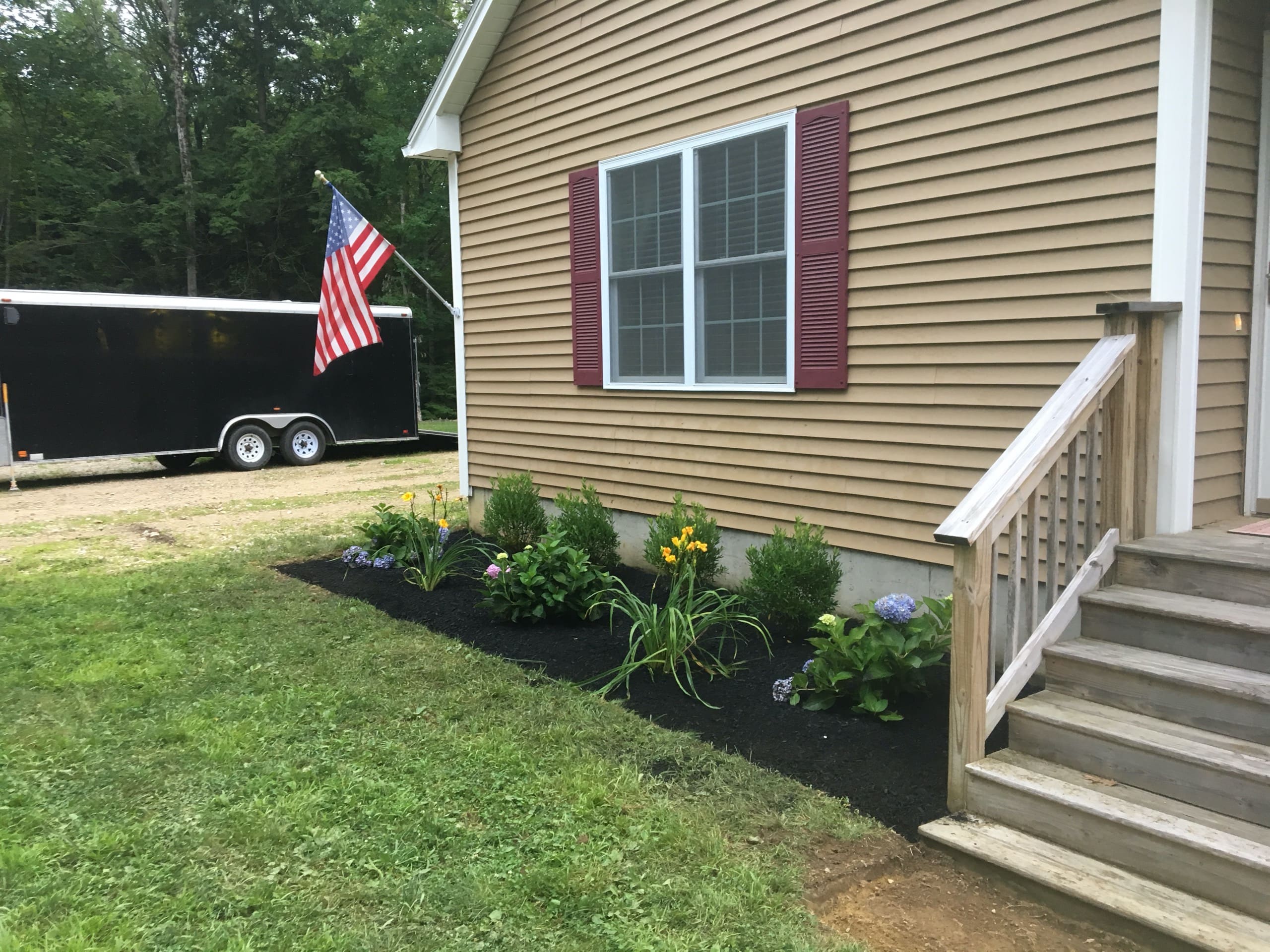 Small planting bed in front of New Hampshire home